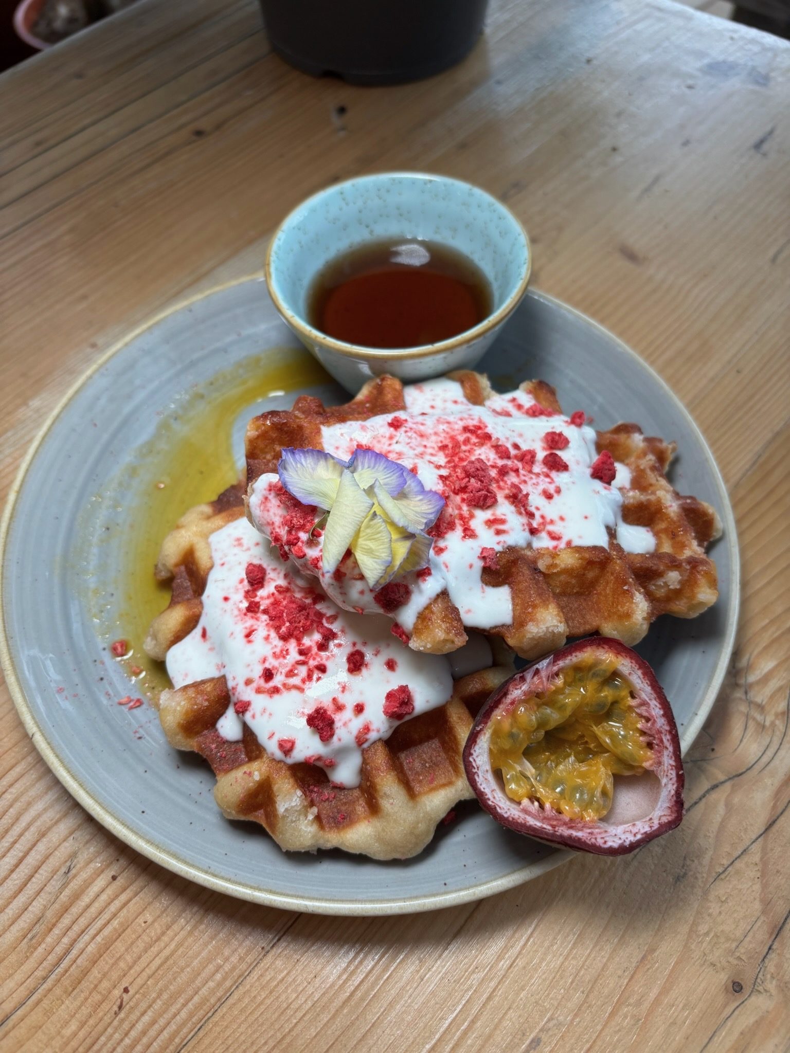 Waffles with fruit and syrup at Roost
